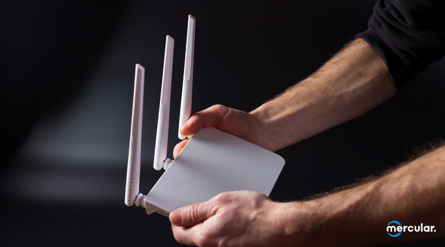 man pick up white wifi router