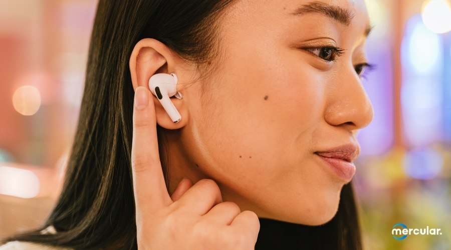 how to connect airpods woman wearing finger touch