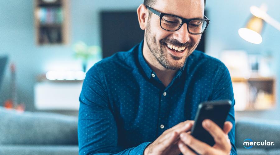 man happy using smartphone